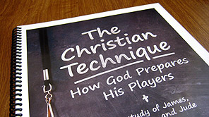 A photo of the Coaches Outreach playbook cover